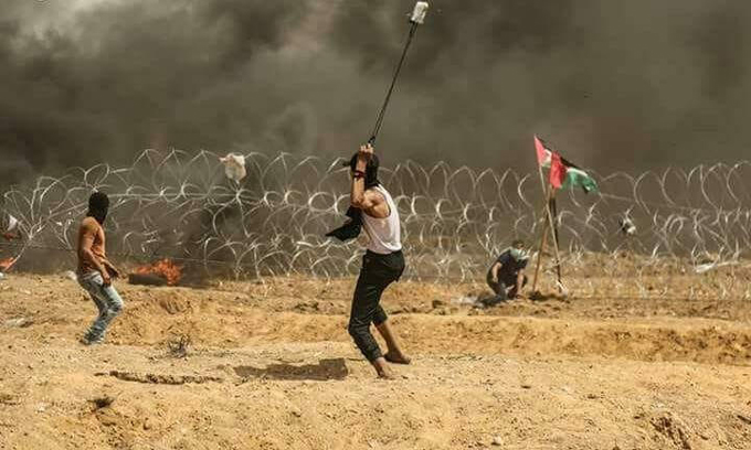 شهيد و968 إصابة بمسيرة العودة الكبرى في غزة